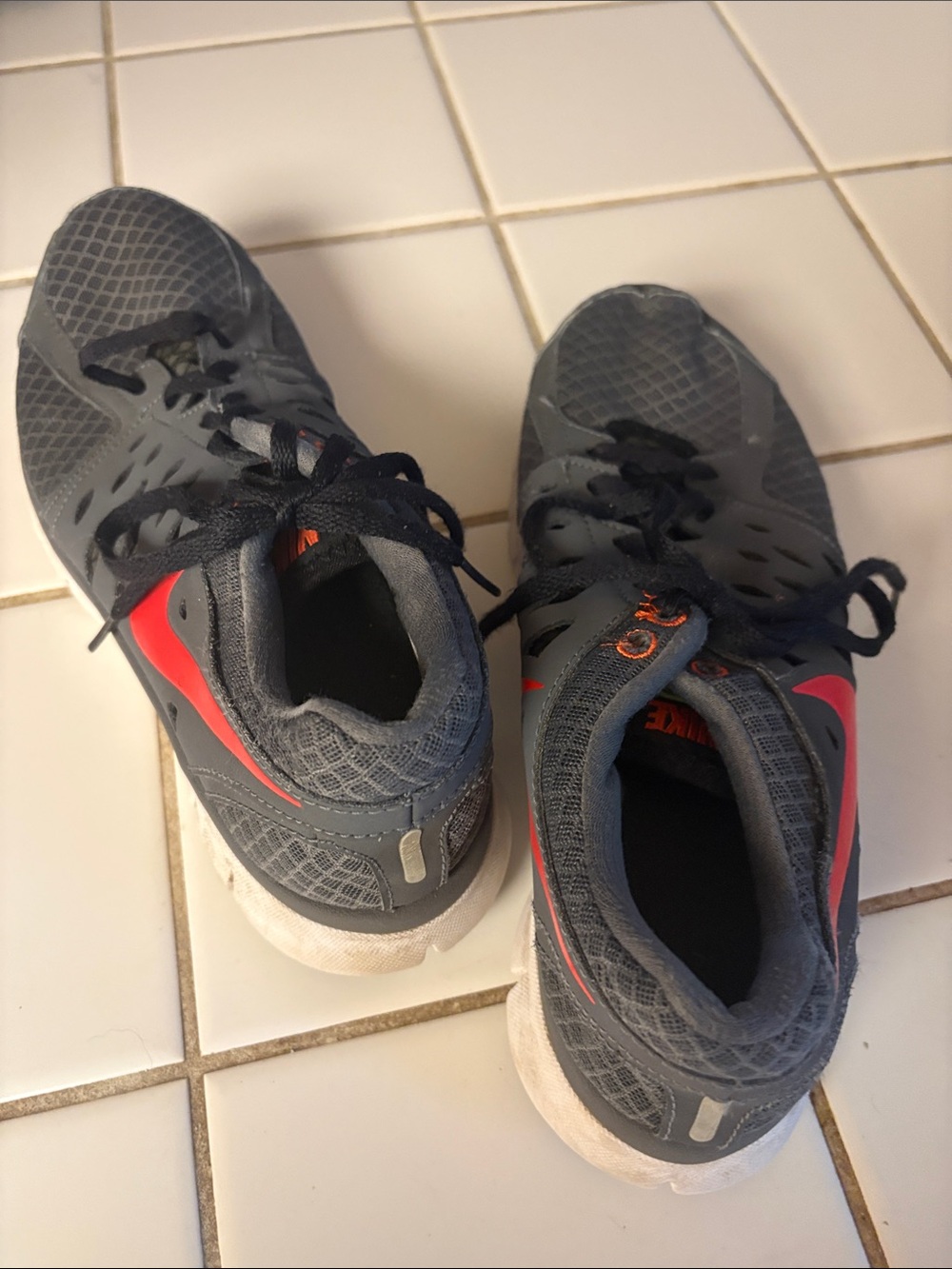 Nike Gray Sneakers with Red Swoosh Accents